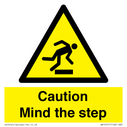 Caution Mind the step warning sign Text: 